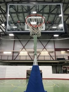 An adjustable basketball net in the Field House